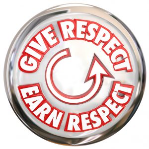 Give Respect to Earn Respect words on a button to show the cycle of winning reverence, honor and trust of others